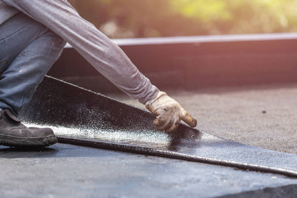 Professional Exterior Waterproofing technician working in Idlewild, MI